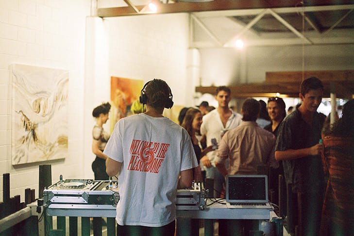 a DJ at an art gallery